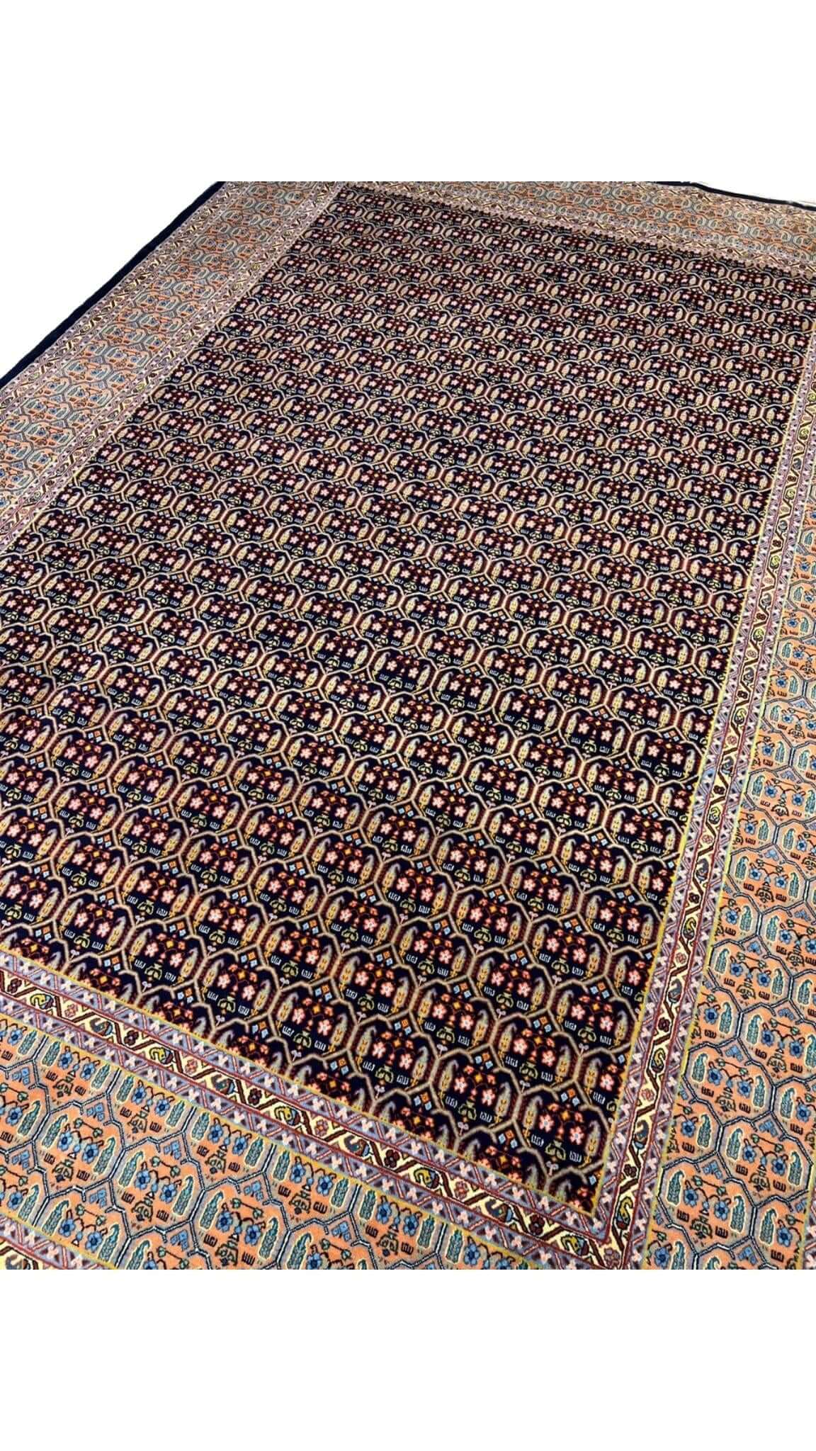 Hand-knotted Persian rug with intricate pattern, wool and silk blend